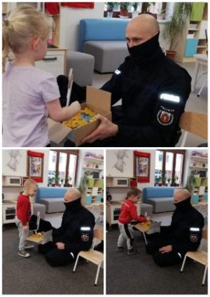 Policjant wręczający dziecku upominki